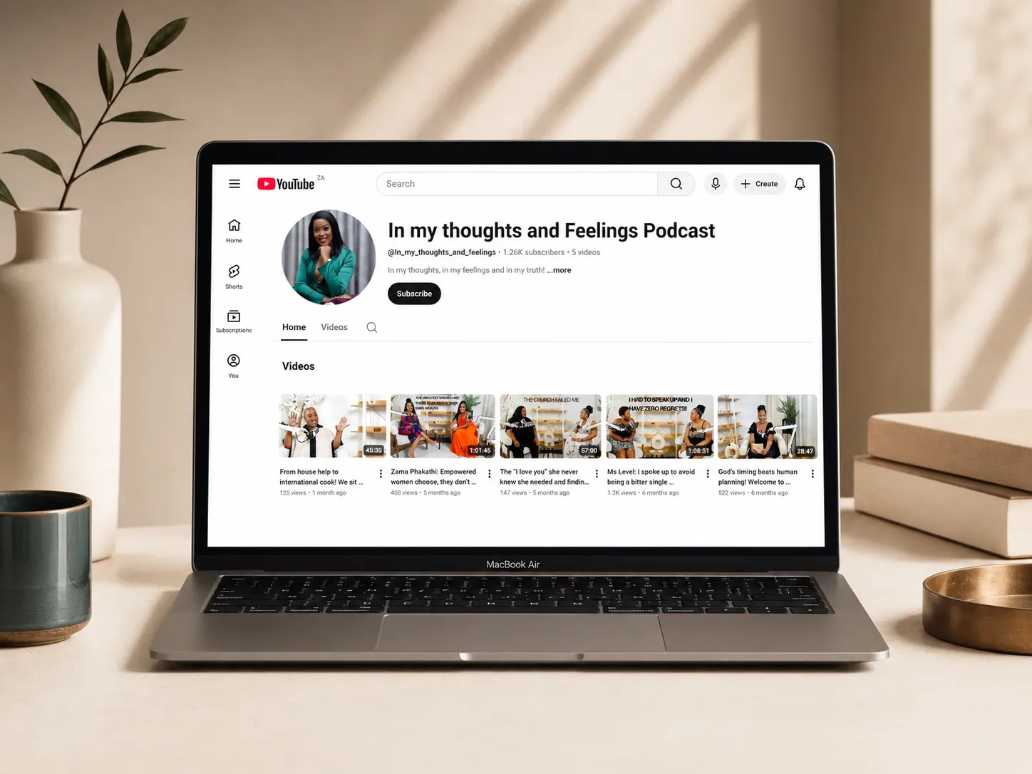 Laptop mockup showing a podcast brand channel and visual content system